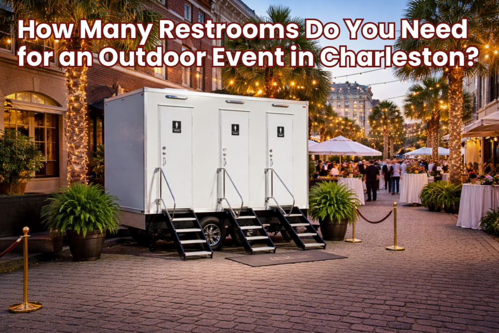 High Cotton luxury restroom trailer set up at a Charleston outdoor event with guests enjoying the celebration nearby