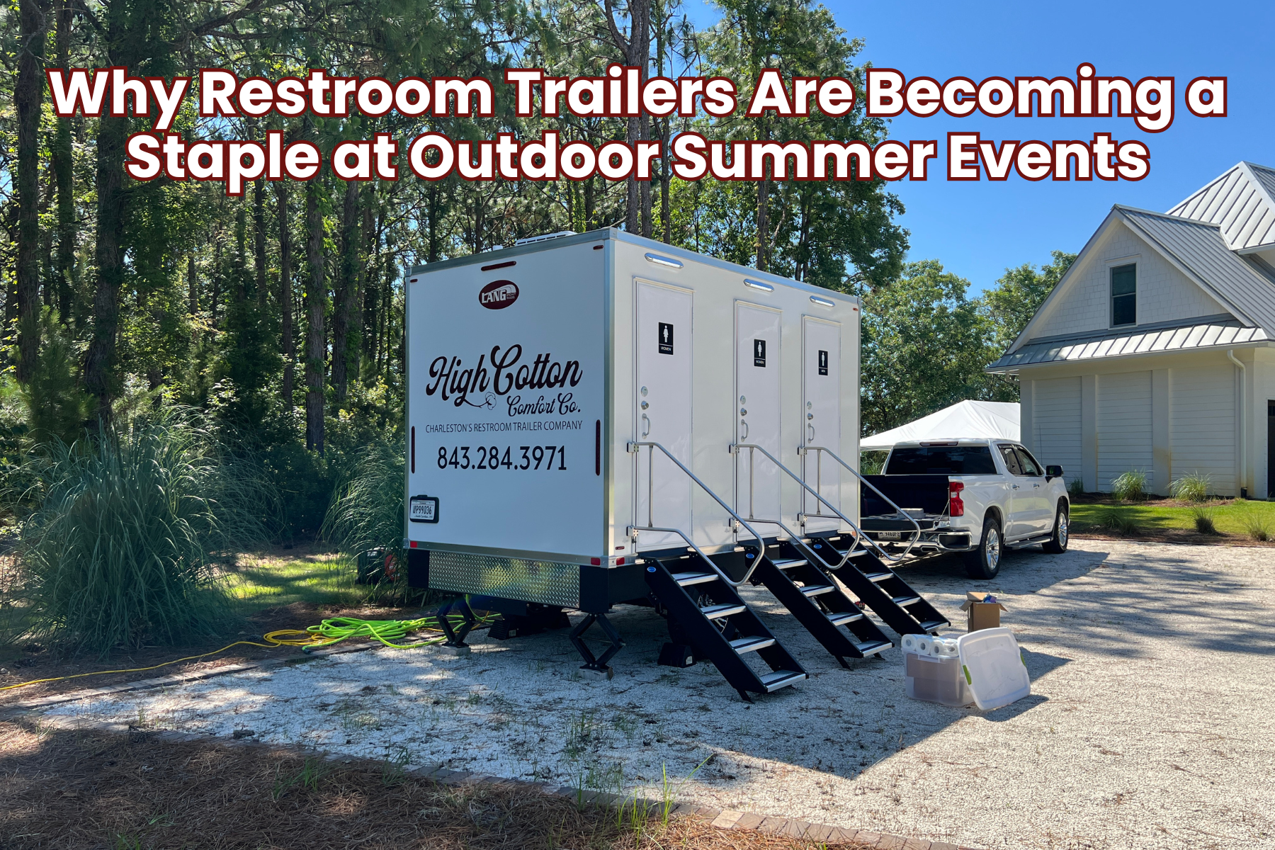 Luxury outdoor event restroom trailer set up at a summer celebration